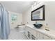 A uniquely decorated bathroom features a black and white tiled floor, and vanity sink at 16453 Nc Hwy 73 Hwy, Albemarle, NC 28001