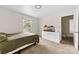 A bedroom with neutral walls features a bed, dresser and large window at 16453 Nc Hwy 73 Hwy, Albemarle, NC 28001