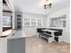 An eat-in dining area with built in seating and cabinetry near the renovated kitchen at 16453 Nc Hwy 73 Hwy, Albemarle, NC 28001