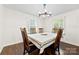 Cozy dining room features a classic table setting with natural light at 16453 Nc Hwy 73 Hwy, Albemarle, NC 28001