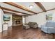 Comfortable living space featuring a stone fireplace and hardwood flooring at 16453 Nc Hwy 73 Hwy, Albemarle, NC 28001