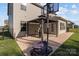 Spacious backyard with a covered patio, basketball hoop, and well-maintained lawn at 1725 Mill Creek Sw Ln, Concord, NC 28025