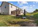 Beautiful backyard with a patio, bench, and plenty of room for outdoor activities at 1725 Mill Creek Sw Ln, Concord, NC 28025