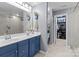 Bathroom with dual sinks, and a walk-in closet at 1725 Mill Creek Sw Ln, Concord, NC 28025