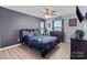 Bedroom featuring a ceiling fan, and a stylish black and blue patterned comforter at 1725 Mill Creek Sw Ln, Concord, NC 28025