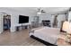 Large primary bedroom with walk-in closet, entertainment center, and en-suite bathroom at 1725 Mill Creek Sw Ln, Concord, NC 28025