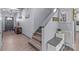 Hallway with wooden staircase, decor and bench with extra storage at 1725 Mill Creek Sw Ln, Concord, NC 28025
