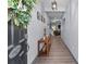 Inviting entryway with wood floors, decorative console table, and charming decor creates a warm welcome at 1725 Mill Creek Sw Ln, Concord, NC 28025