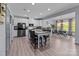Bright, open kitchen features a center island, updated appliances, and an adjacent dining area, perfect for modern living at 1725 Mill Creek Sw Ln, Concord, NC 28025