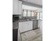Bright kitchen features stainless steel appliances, granite countertops, and lots of natural light from the backyard at 1725 Mill Creek Sw Ln, Concord, NC 28025