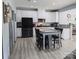 Bright kitchen features white cabinets, stainless steel appliances, granite countertops, and a center island with seating at 1725 Mill Creek Sw Ln, Concord, NC 28025
