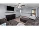 Cozy living room with stylish furnishings, a modern TV, and lots of natural light at 1725 Mill Creek Sw Ln, Concord, NC 28025