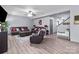 Spacious living room with wood floors, stylish furnishings, and open layout, ideal for entertaining at 1725 Mill Creek Sw Ln, Concord, NC 28025