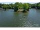 Captivating aerial view of a charming home situated on a picturesque island, accessible by water at 17835 Terryglass Ln, Charlotte, NC 28278