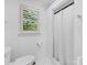 Bathroom with a stand-up shower and natural light from a window with slatted blinds at 17835 Terryglass Ln, Charlotte, NC 28278