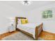 Bright bedroom with hardwood floors, a comfortable bed, and a neutral color scheme at 17835 Terryglass Ln, Charlotte, NC 28278