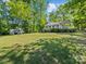 Beautifully landscaped yard surrounds this single-Gathering home with inviting front porch at 17835 Terryglass Ln, Charlotte, NC 28278