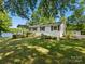 Charming single Gathering home with a cozy front porch and well manicured landscaping at 17835 Terryglass Ln, Charlotte, NC 28278