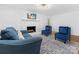 Bright living room featuring a fireplace, plush seating, and hardwood floors at 17835 Terryglass Ln, Charlotte, NC 28278