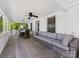 Relaxing covered porch with comfortable seating, perfect for enjoying the outdoors at 17835 Terryglass Ln, Charlotte, NC 28278