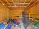 Interior of a shed filled with recreational equipment and storage shelves at 17835 Terryglass Ln, Charlotte, NC 28278