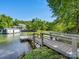 View of a lakefront dock and a beautiful view of the water and trees at 17835 Terryglass Ln, Charlotte, NC 28278