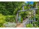 Backyard garden featuring a cute gate and lots of decorative foliage at 200 Winter Flake Dr, Statesville, NC 28677