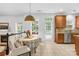 Bright dining area next to the open-concept living space, ceramic tile, and lots of natural light at 200 Winter Flake Dr, Statesville, NC 28677