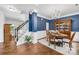 Elegant dining area features hardwood floors, a chandelier, a hutch, and a view to the home's front door at 200 Winter Flake Dr, Statesville, NC 28677