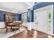 Stately foyer showcases hardwood floors, a chandelier-lit dining area, and a view of the elegant front entrance at 200 Winter Flake Dr, Statesville, NC 28677