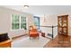 Sitting area hallway with hardwood floors, bright windows and natural light at 200 Winter Flake Dr, Statesville, NC 28677