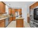 Well-equipped kitchen featuring wood cabinets, stainless steel appliances, and a functional center island at 200 Winter Flake Dr, Statesville, NC 28677