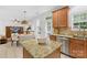 Bright eat-in kitchen with granite countertops, stainless appliances, and ample storage space at 200 Winter Flake Dr, Statesville, NC 28677