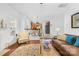 Open living room featuring hardwood floors, ample natural light, and a seamless transition to the kitchen at 200 Winter Flake Dr, Statesville, NC 28677
