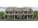 Attractive townhome exterior with mixed siding, black shutters, covered porch, and tidy landscaping at 2024 Harlequin Dr, Indian Trail, NC 28079