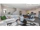 Open-concept living area with modern furnishings, dining space, and a view of the kitchen at 2024 Harlequin Dr, Indian Trail, NC 28079