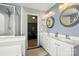 Ensuite bathroom featuring dual vanities, a shower, and a view into the main bedroom at 2324 Oakdale Creek Ln, Charlotte, NC 28216
