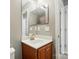 Bathroom features a single sink vanity, a framed mirror, and a neutral color palette at 2324 Oakdale Creek Ln, Charlotte, NC 28216