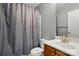Practical bathroom featuring a sink, toilet, shower, and a towel rack at 2324 Oakdale Creek Ln, Charlotte, NC 28216