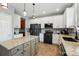 Well-equipped kitchen featuring granite countertops, stainless appliances, a center island, and abundant storage space at 2324 Oakdale Creek Ln, Charlotte, NC 28216