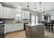 Bright kitchen with granite counters, a gray island, and stainless steel appliances, creating a modern, inviting space at 2324 Oakdale Creek Ln, Charlotte, NC 28216