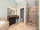 Bathroom featuring a glass shower, soaking tub, and dual vanity at 2406 Tarleton Twins Ter, Charlotte, NC 28270