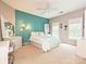 Bright bedroom featuring an accent wall and two windows at 2406 Tarleton Twins Ter, Charlotte, NC 28270