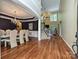 Elegant dining room featuring hardwood floors, a chandelier, and a table set for eight at 2406 Tarleton Twins Ter, Charlotte, NC 28270