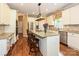 Open kitchen features granite countertops, stainless steel appliances, and a large island with seating at 2406 Tarleton Twins Ter, Charlotte, NC 28270