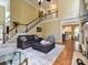 Spacious living room with tall ceilings, hardwood floors, a fireplace, and a staircase at 2406 Tarleton Twins Ter, Charlotte, NC 28270