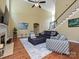 Spacious living room features hardwood floors, fireplace, high ceilings, and natural light at 2406 Tarleton Twins Ter, Charlotte, NC 28270