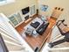 Sunlit living room with a fireplace and hardwood floors viewed from above at 2406 Tarleton Twins Ter, Charlotte, NC 28270