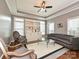 Cozy living room with built-in shelving, a large window, and comfortable seating at 2406 Tarleton Twins Ter, Charlotte, NC 28270