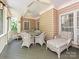 Inviting screened-in porch with comfortable seating perfect for outdoor relaxation and entertaining at 2406 Tarleton Twins Ter, Charlotte, NC 28270